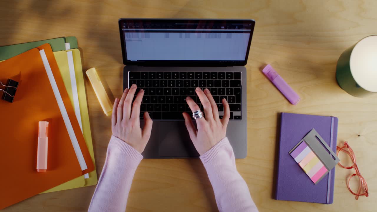 Person Working on Laptop at Desk