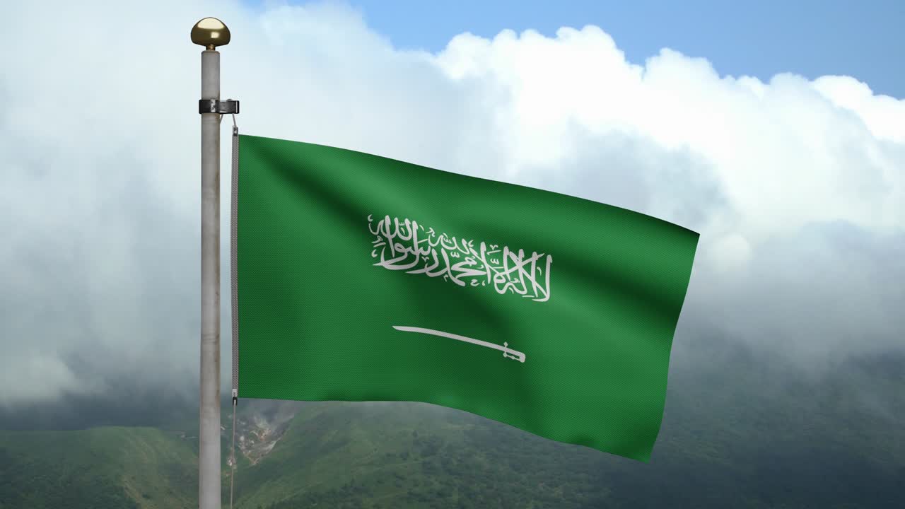 el reino de arabia saudita agita la bandera en el viento en la montaña.