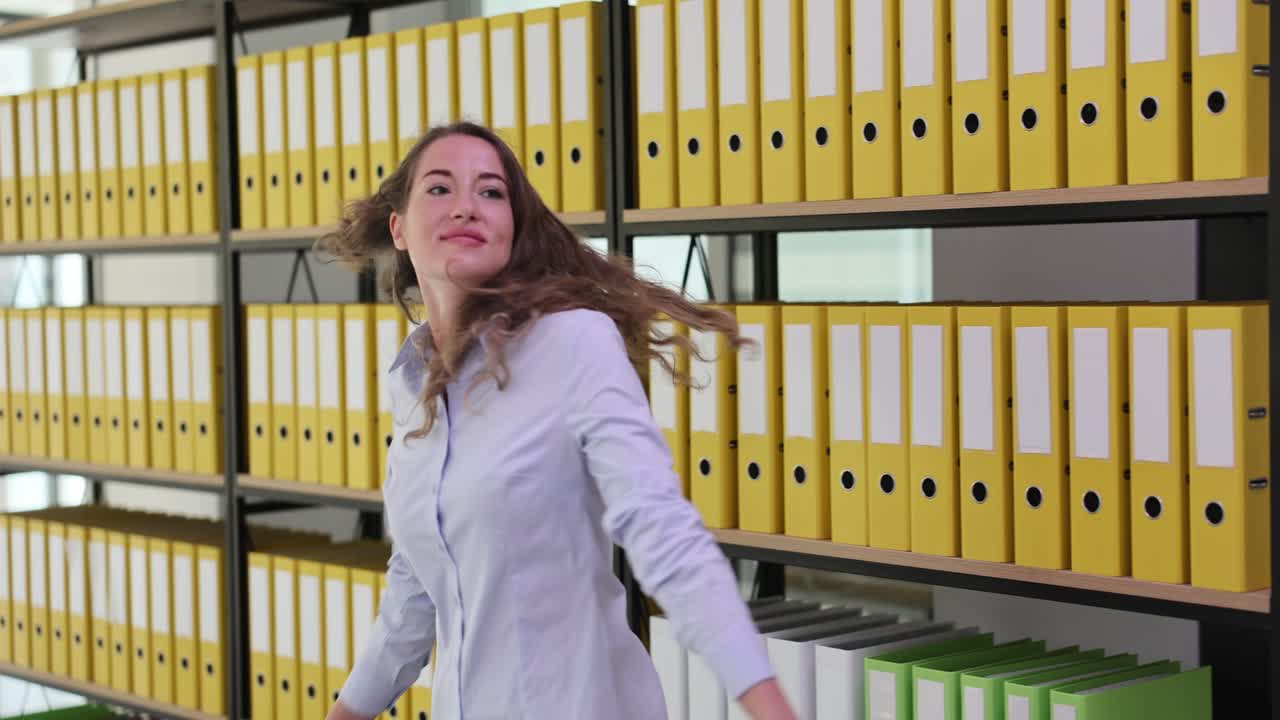 Woman in Office with Binders