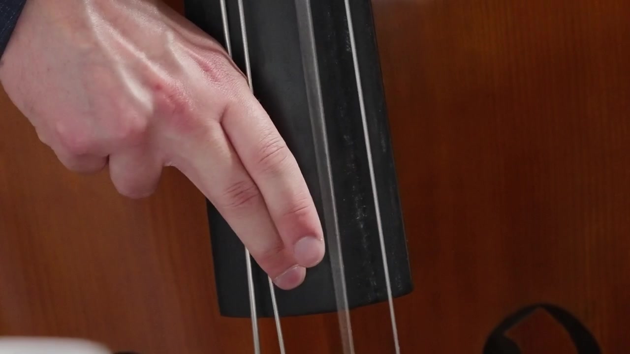 Close-up of a musician playing the cello.