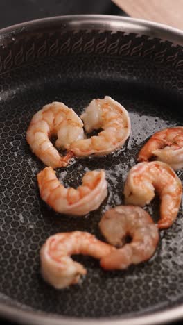 cooking shrimp in a pan