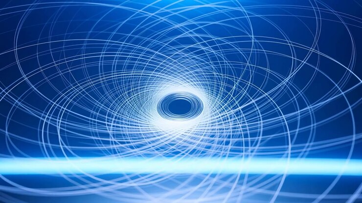 L'inquadratura centrale di una sequenza astratta di cinque secondi mostra un tunnel blu formato da anelli concentrici che spiraleggiano verso un nucleo incandescente