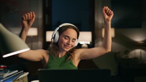 Festive-person-dancing-home-closeup.-Woman-listening-enjoying-energetic-music