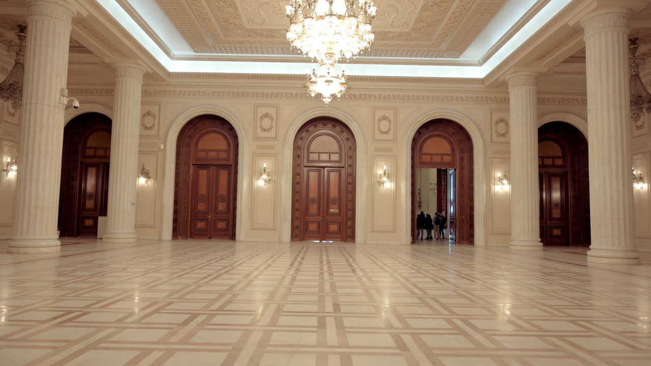 Bucharest, Romania - December 17, 2021: People walking on the inside of the Palace of Parliament
