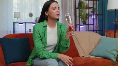 sad depressed young woman girl suffers from unrequited love, drinking champagne, problem, bad news