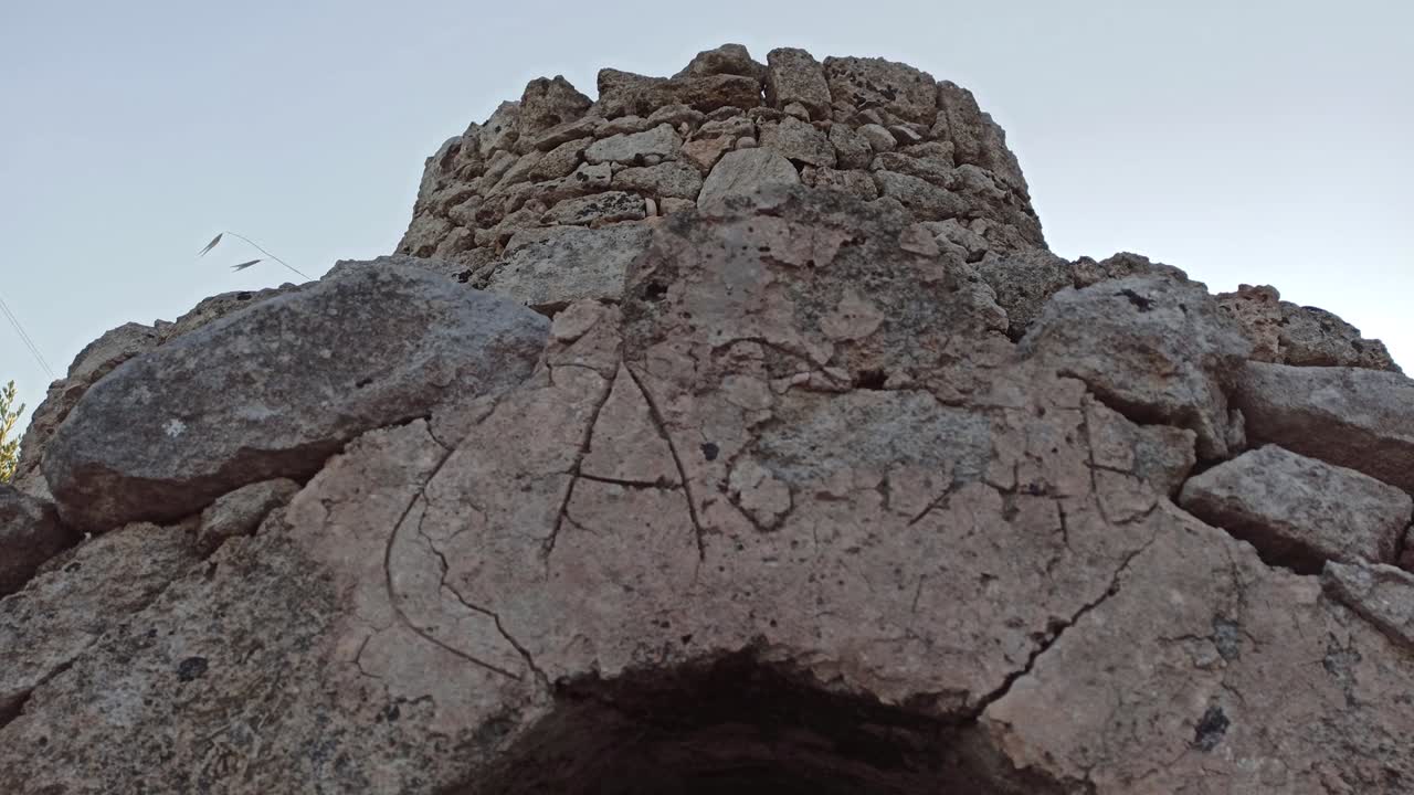 Beautiful trullo with olive grove, Manduria, Southen Italy. View of conical roof of traditional dry stone trullo house