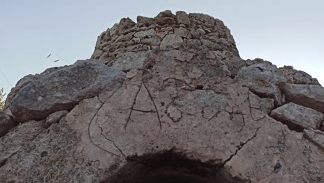 beautiful trullo with olive grove, manduria, southen italy. view of conical roof of traditional dry stone trullo house