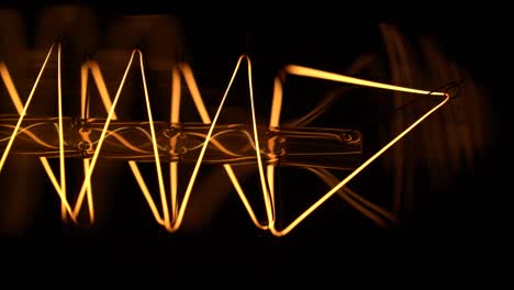 close-up of a filament in an edison-style light bulb