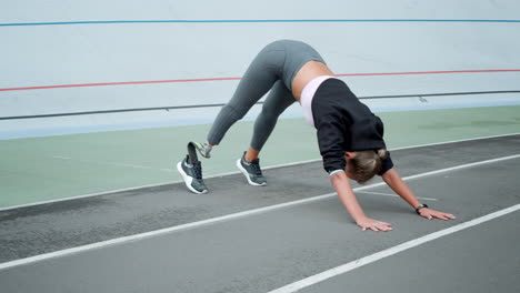 young woman exercising outdoors