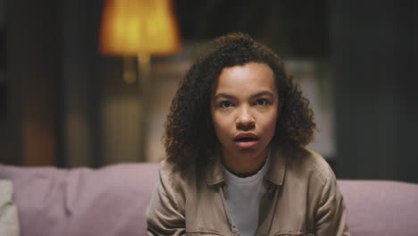 afro girl watching exciting film