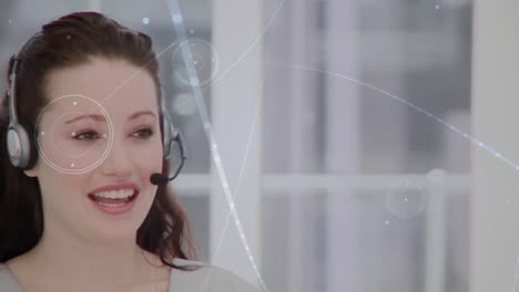 Animation-of-network-of-connections-over-businesswoman-using-phone-headsets