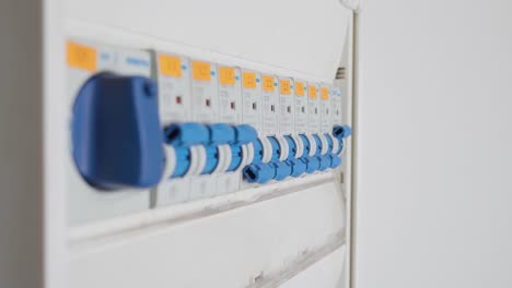 man flipping a single circuit breaker switch on and off