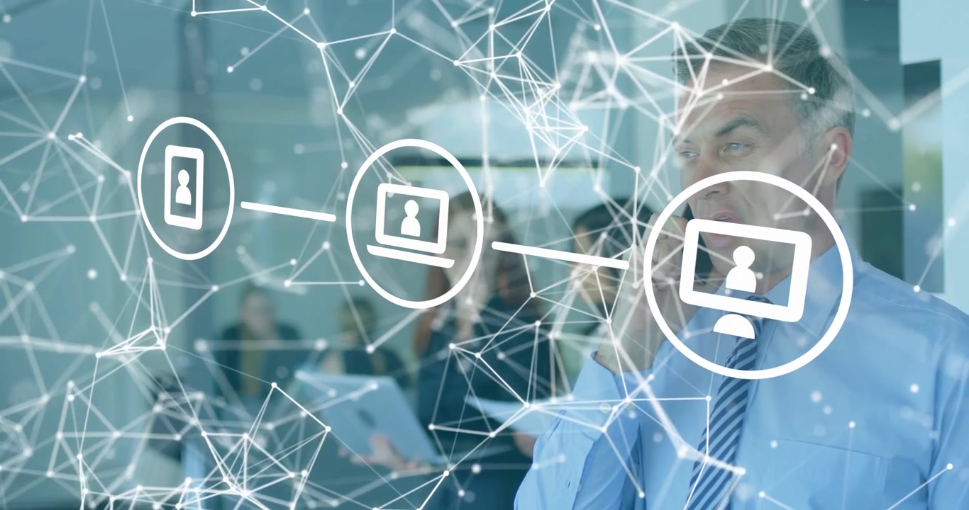 Man speaking on phone in business office, phone call initiating animated device network aiding team