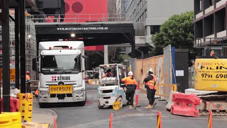 workers and machinery at a city building project