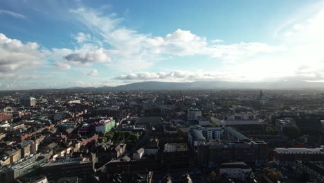 dublin, ireland, aerial view of cityscape skyline on sunny day, establishing pedestal drone shot