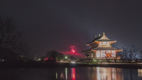 fireworks over a japanese temple at night