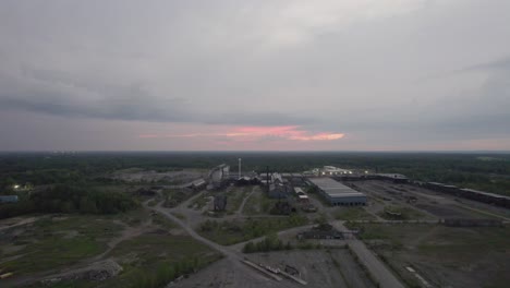 A-drone-shot-of-an-old-non-functional-windmill-in-a-sunset-light