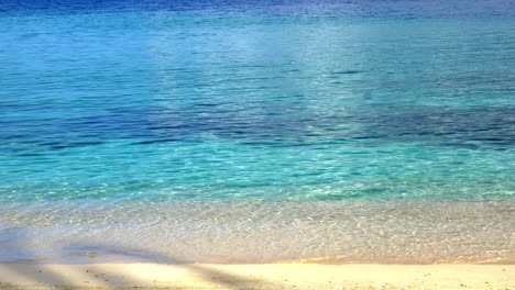 crystal clear turquoise water on white sandy beach