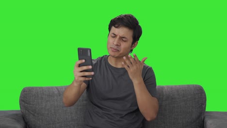 Angry-Indian-man-shouting-on-video-call-Green-screen