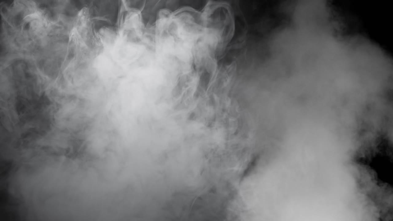 Realistic white smoke or fog rises from bottom of frame on black background. Use as overlay for atmospheric, moody, or mysterious scenes