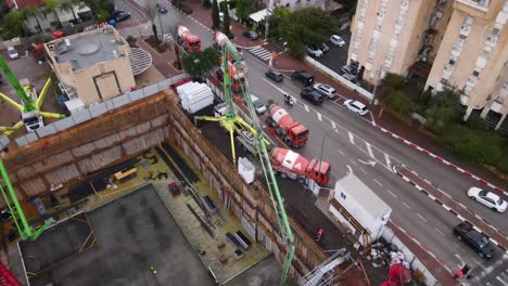 aerial view of skyscrapers in construction with heavy machines working, tel aviv, israel