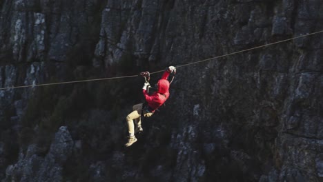 young caucasian man zip lining