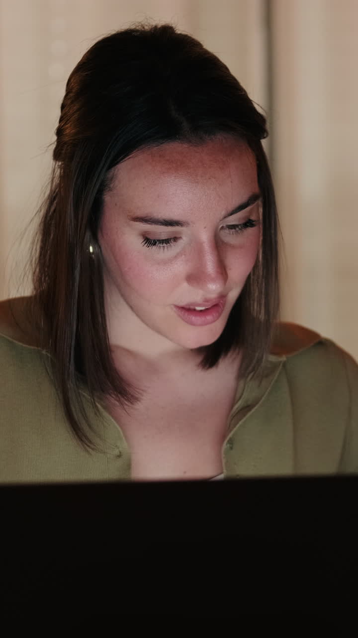 Close up of Woman Working From Home on Laptop at Night