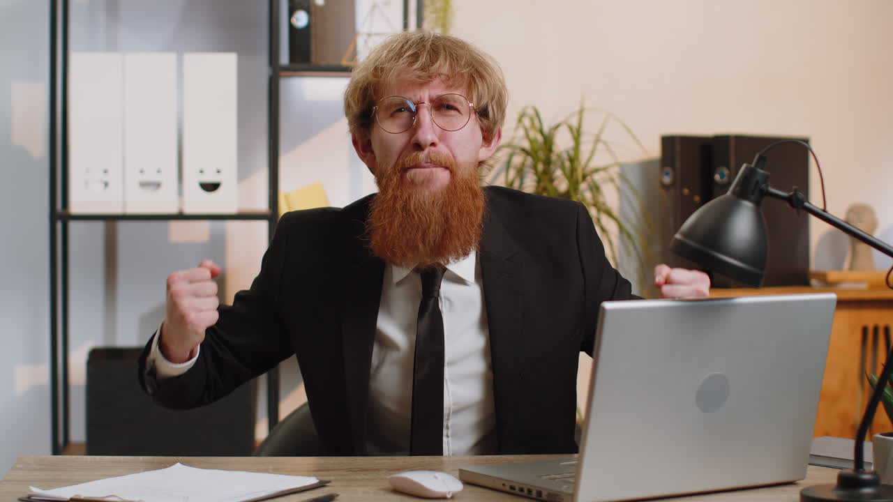 Happy amazed businessman shocked by sudden victory game winning lottery goal achievemen good news