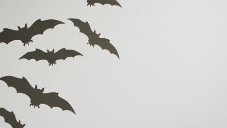 multiple halloween bat icons with copy space on grey background