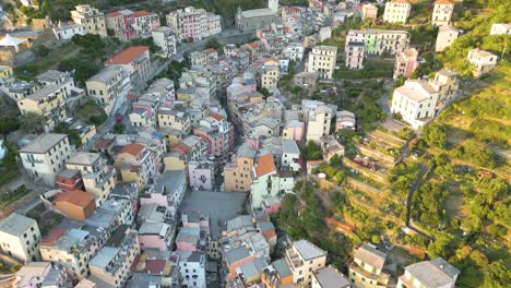 High-Aerial-Pullback-Reveals-Riomaggiore-on-Italian-Riviera-in-Cinque-Terre,-Italy