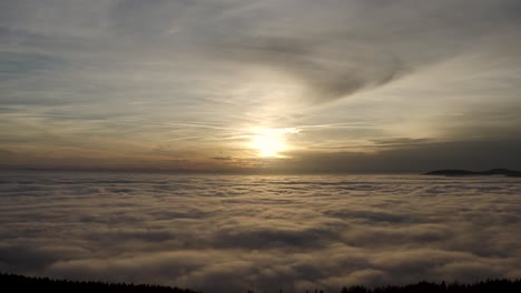 drone-flight-over-the-clouds-into-the-sunset