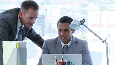 Businessmen-speaking-in-office