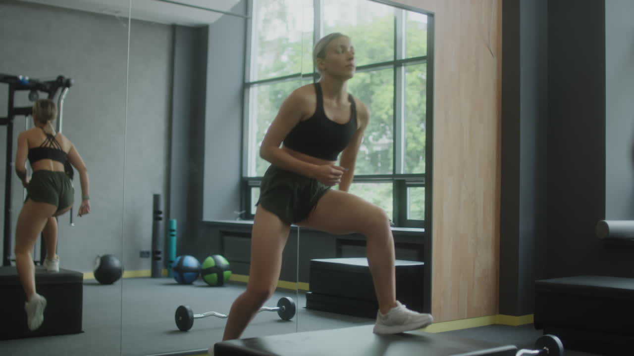 Woman Training and Exercising in a Modern Gym