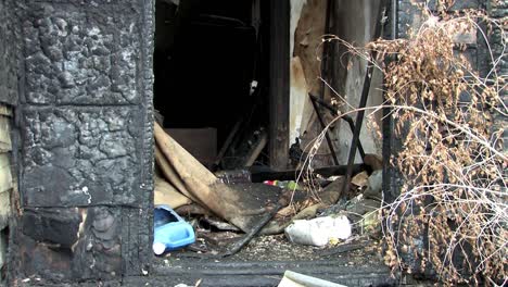 urban decay, medium shot of burnt down house in detroit, michigan, usa