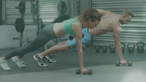 animación de luz brillante sobre un hombre y una mujer en forma haciendo ejercicio en el gimnasio