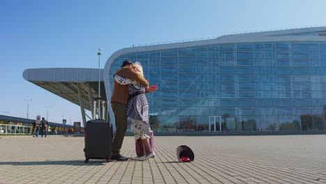 senior old husband and wife retirees tourists reunion meeting in airport terminal after traveling