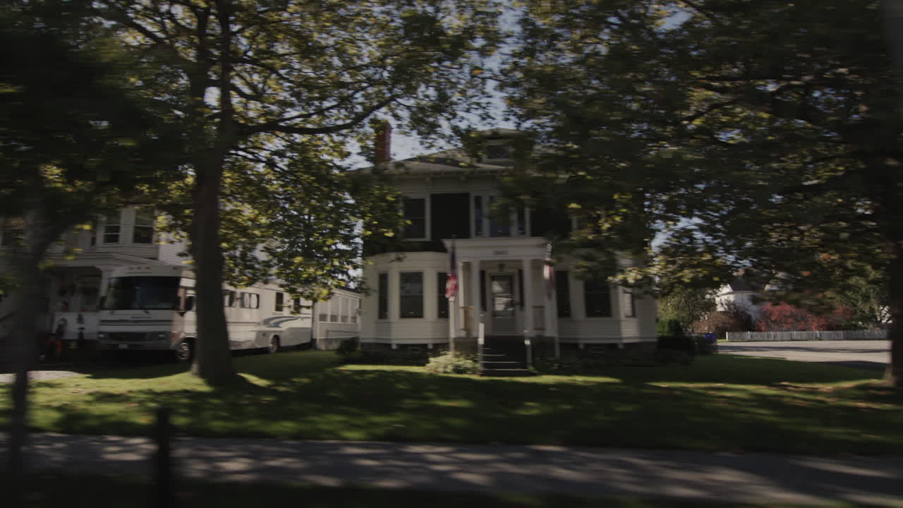 Wilson, NY, USA, October 2021: Drive forward on a road through a typical American city.