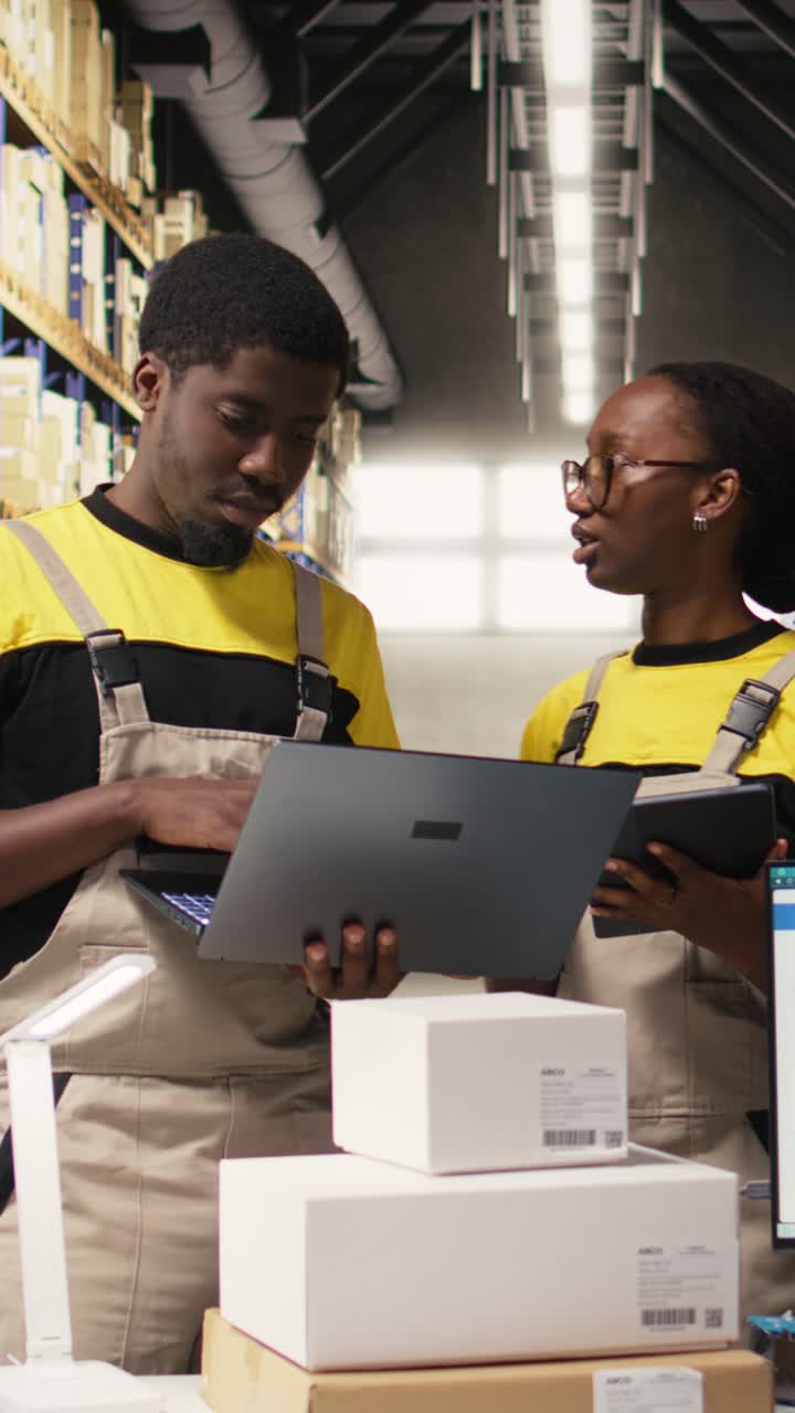 Vertical Video Black workers team preparing merchandise for dispatch in large warehouse