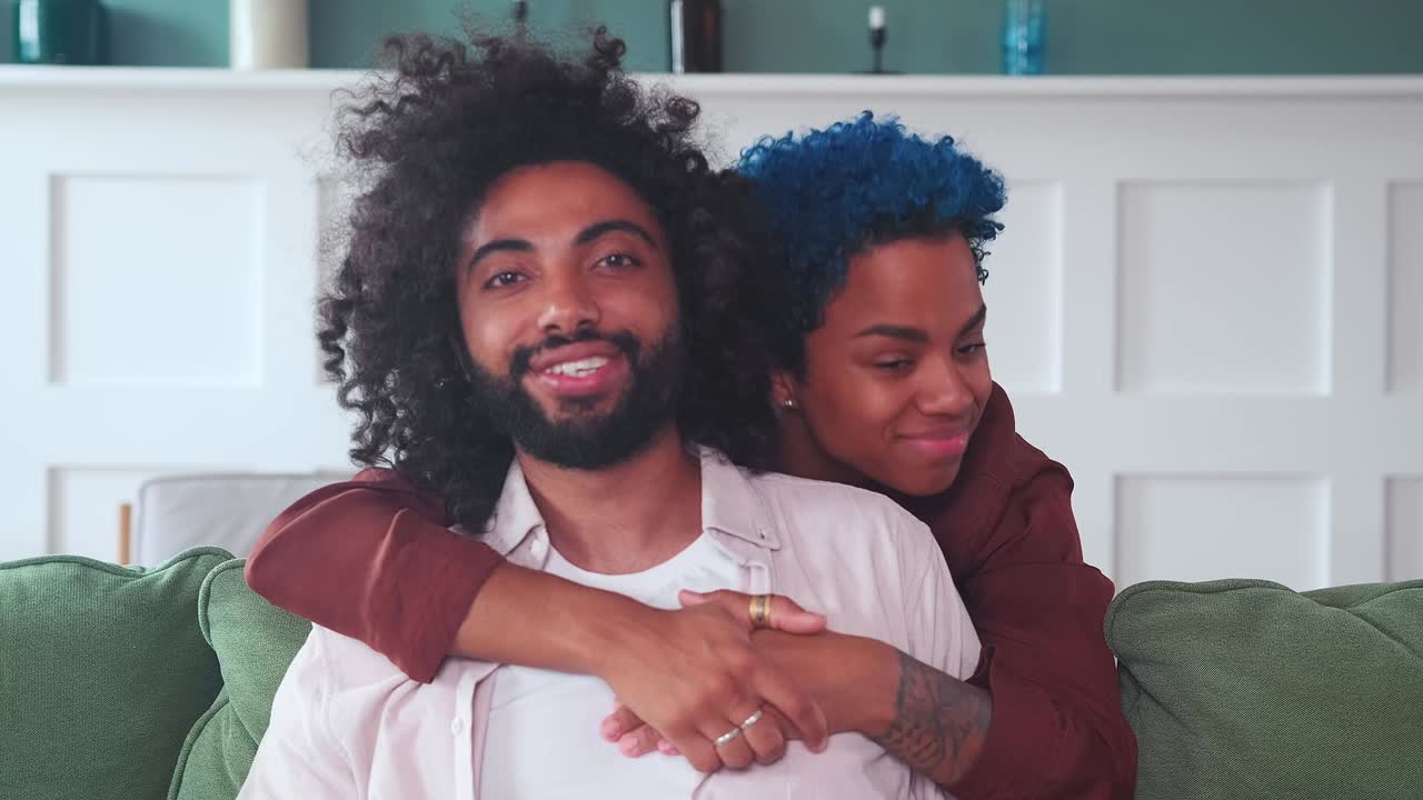 Young multiracial couple african american woman and arabian man posing together