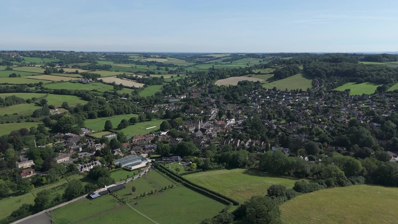 Aerial fast ascend of vista Box, Ashley Wiltshire on a summers day
