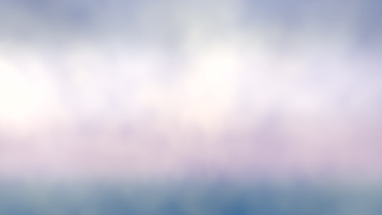 Blurred sunset sky colorful clouds and sun - pink, purple, and blue