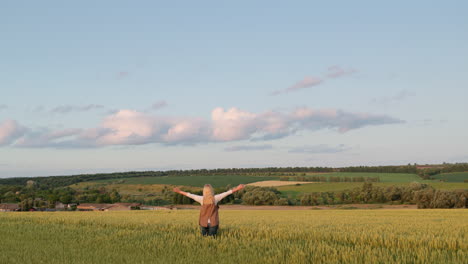 Middle-aged-woman-enjoys-a-walk-in-the-picturesque-countryside