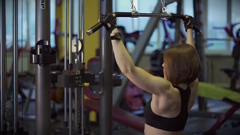 woman working out on a cable machine