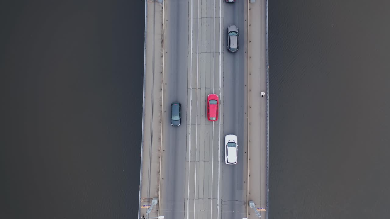 Drone rotation. Road junction and bridge on river in the city, aerial view