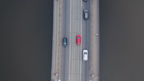 drone rotation. road junction and bridge on river in the city, aerial view