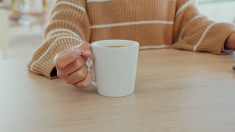 hands, tea or coffee at laptop with woman