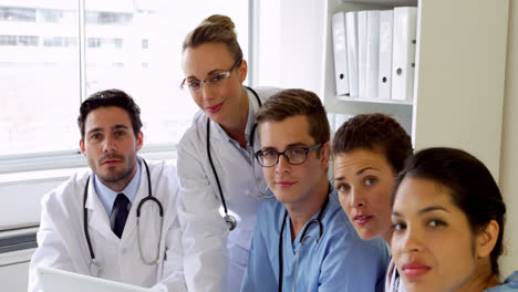 medical team having a meeting looking at laptop