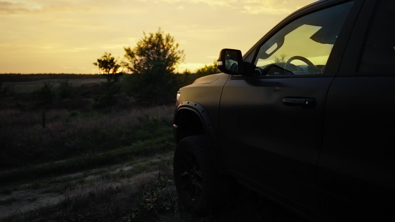 Pickup Off Road Truck Silhouetted Static at Sunset - Revealing shot
