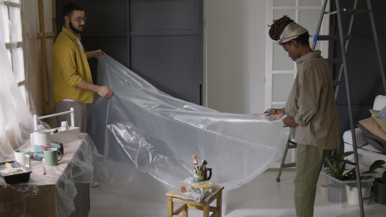 Couple Preparing Room for Painting