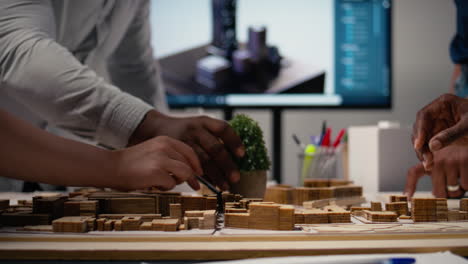 close up of developers work together on layout city planning initiative